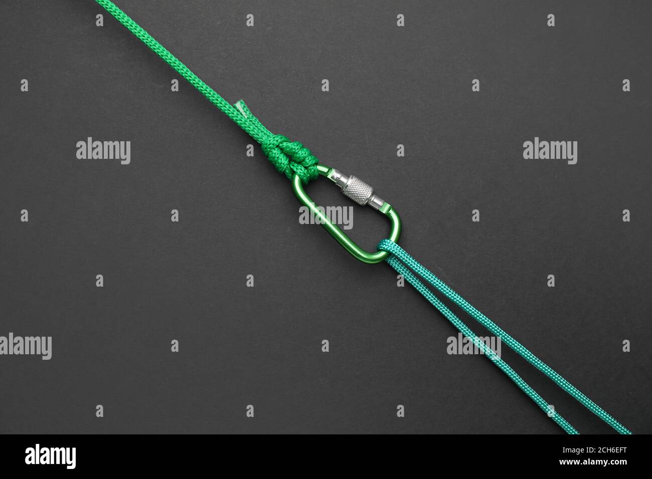 Ropes with lobster clasp on dark background Stock Photo Alamy