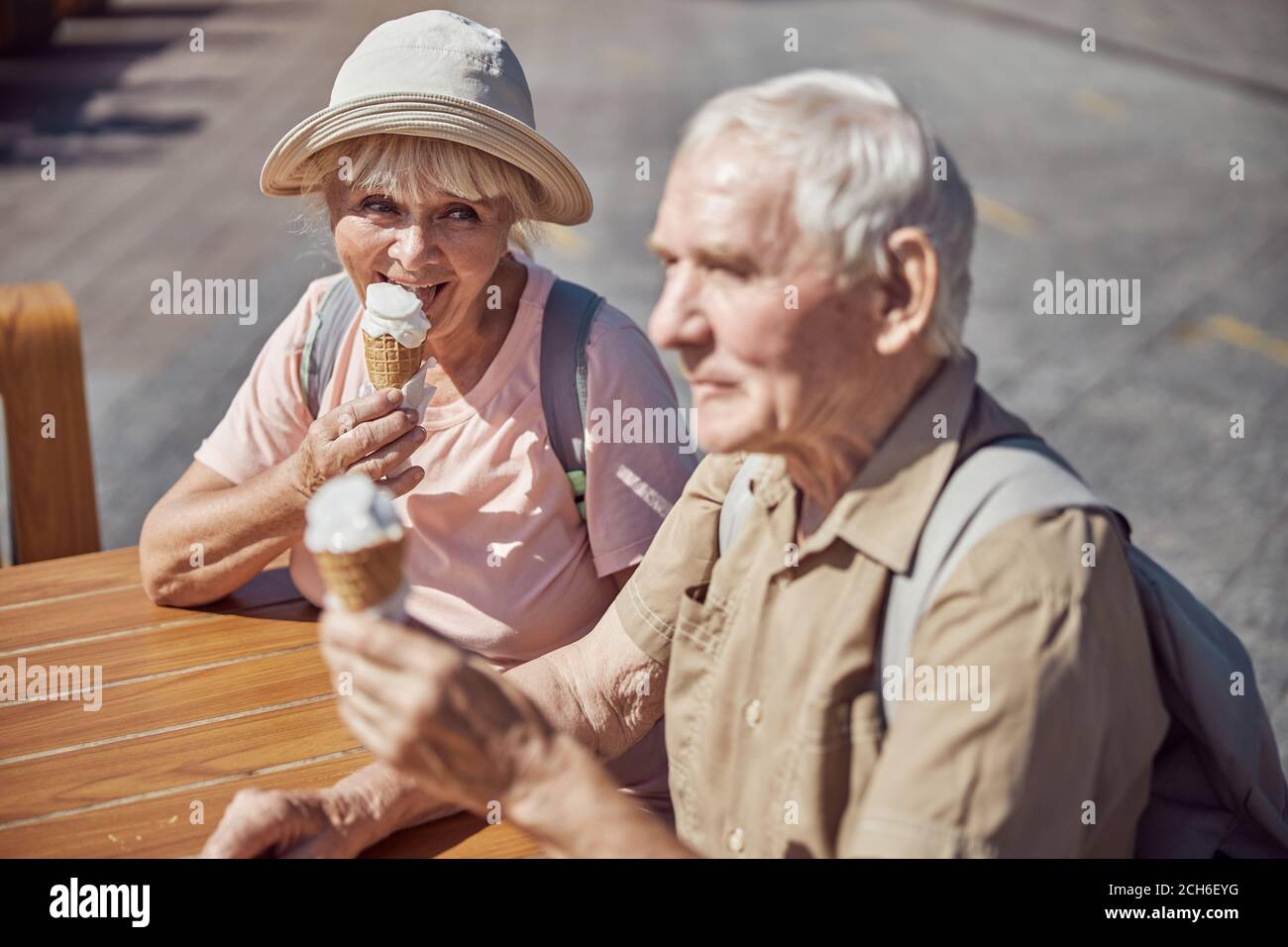 Pleased senior woman enjoying her a tasty dessert Stock Photo