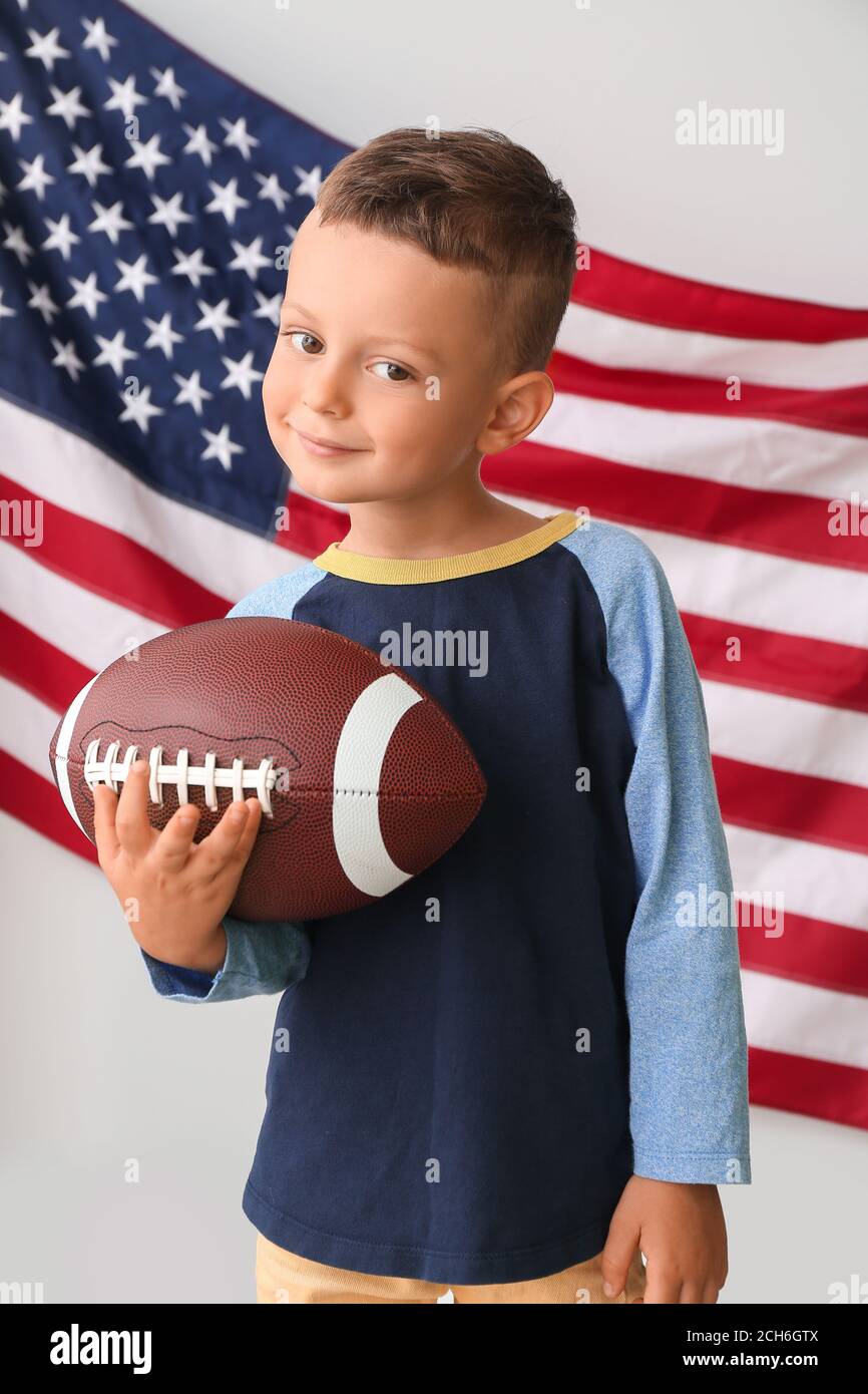Little boy with rugby ball against USA flag Stock Photo Alamy