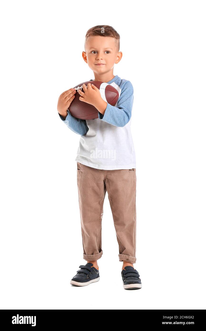 Little boy with rugby ball on white background Stock Photo - Alamy