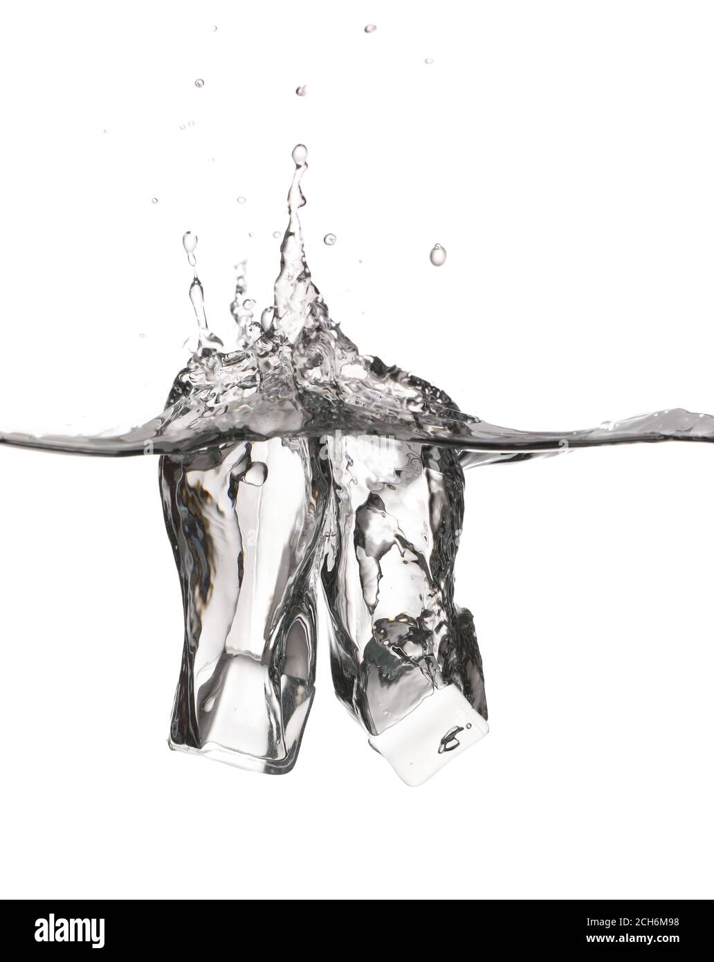 Falling of ice cubes into water on white background Stock Photo - Alamy