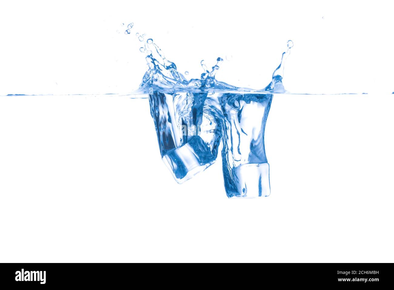 Falling of ice cubes into water on white background Stock Photo - Alamy