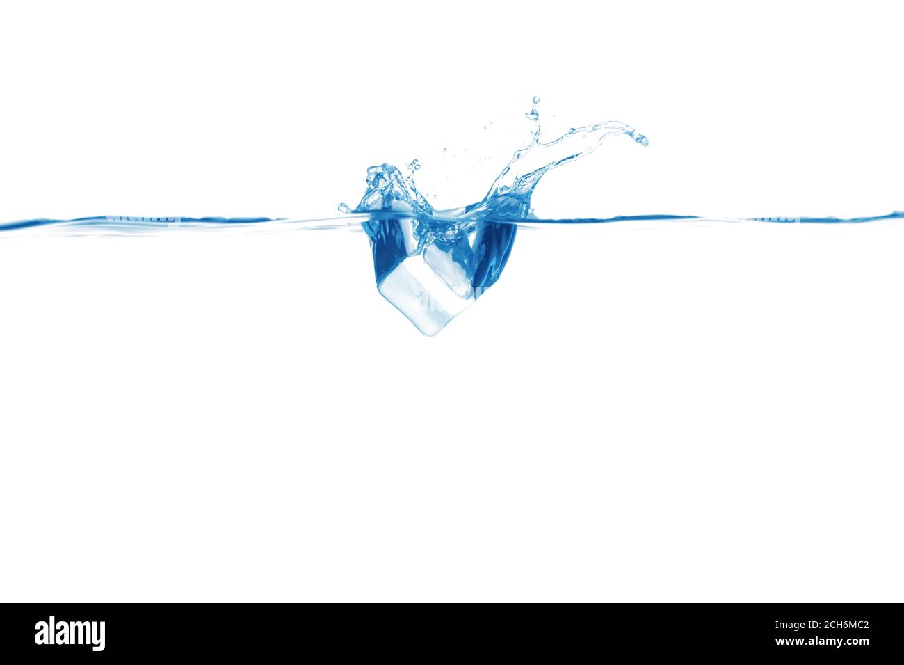 Falling of ice cube into water on white background Stock Photo - Alamy