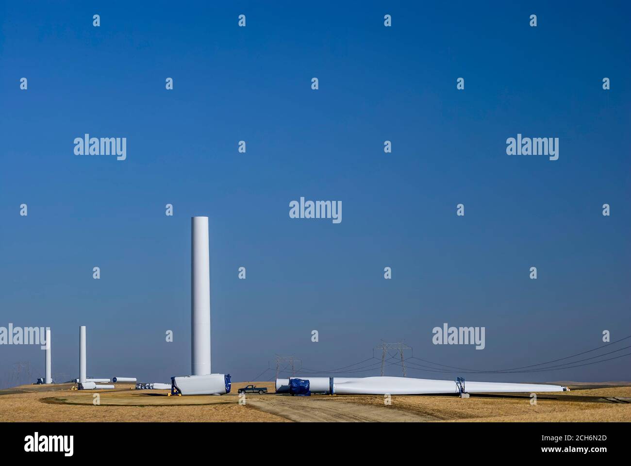 Wind turbine columns, nacelles, and blades, ready to assemble during