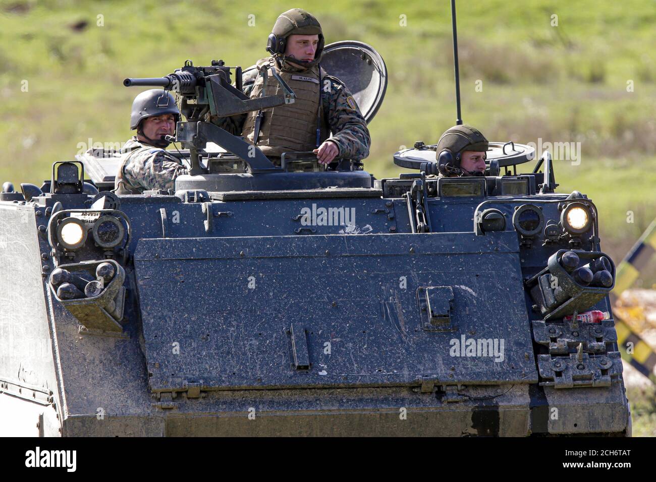 Bosnian soldiers rides on APC  during Military Exercise “Quick Response 2016” at fire range Manjaca near Banja Luka, 300 kms west of Sarajevo, Bosnia, Stock Photo