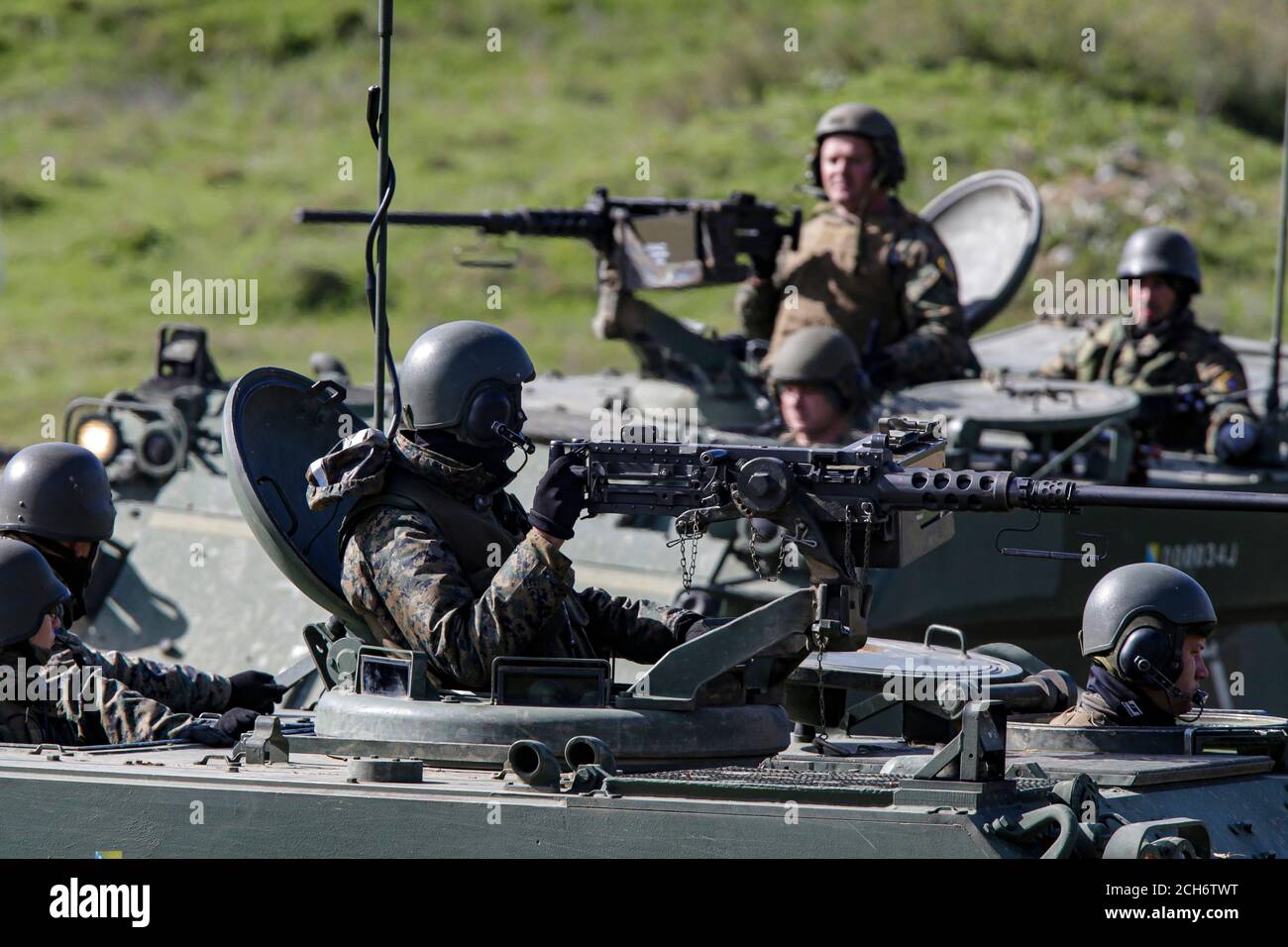 Bosnian soldiers rides on APC  during Military Exercise “Quick Response 2016” at fire range Manjaca near Banja Luka, 300 kms west of Sarajevo, Bosnia, Stock Photo