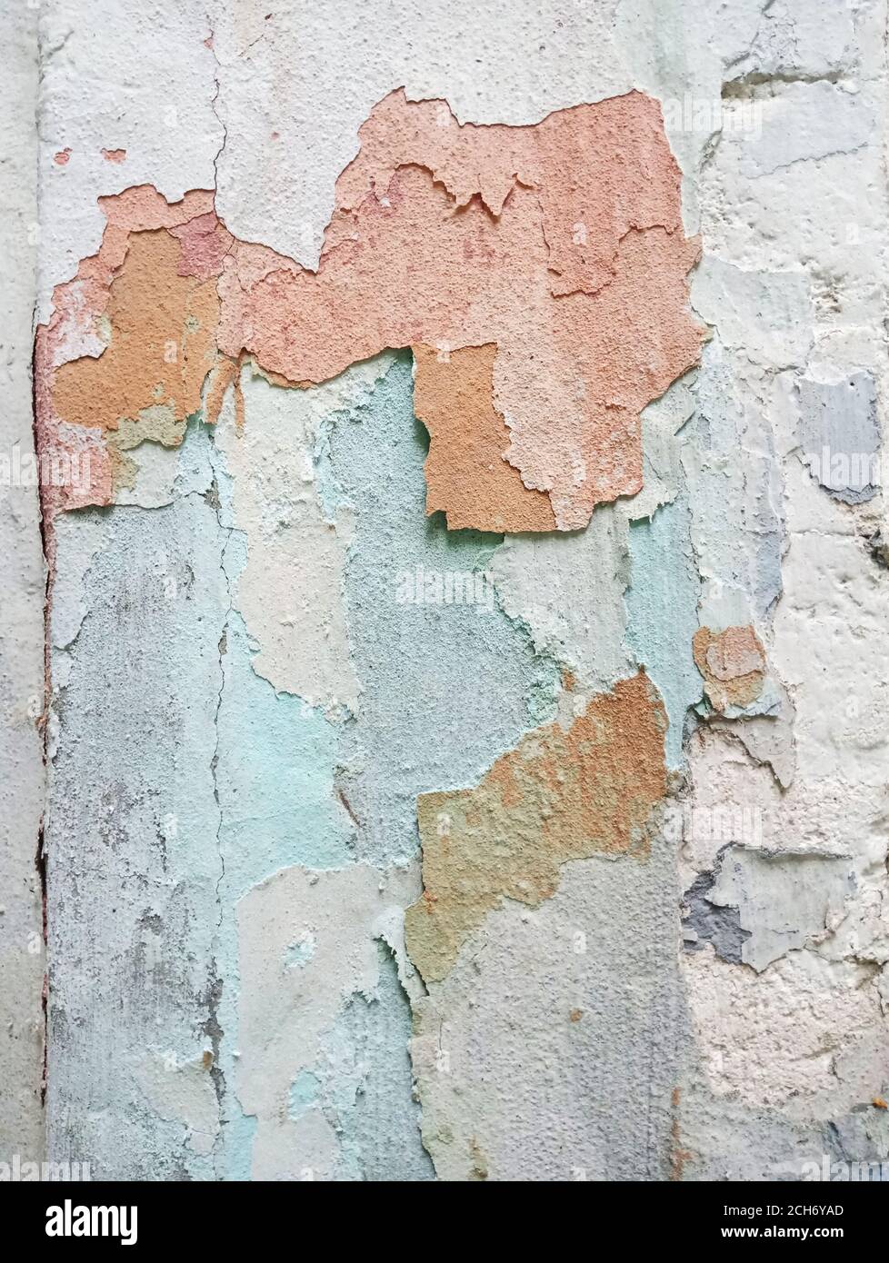 Texture colored old plaster with visible layers of paint. Stock Photo