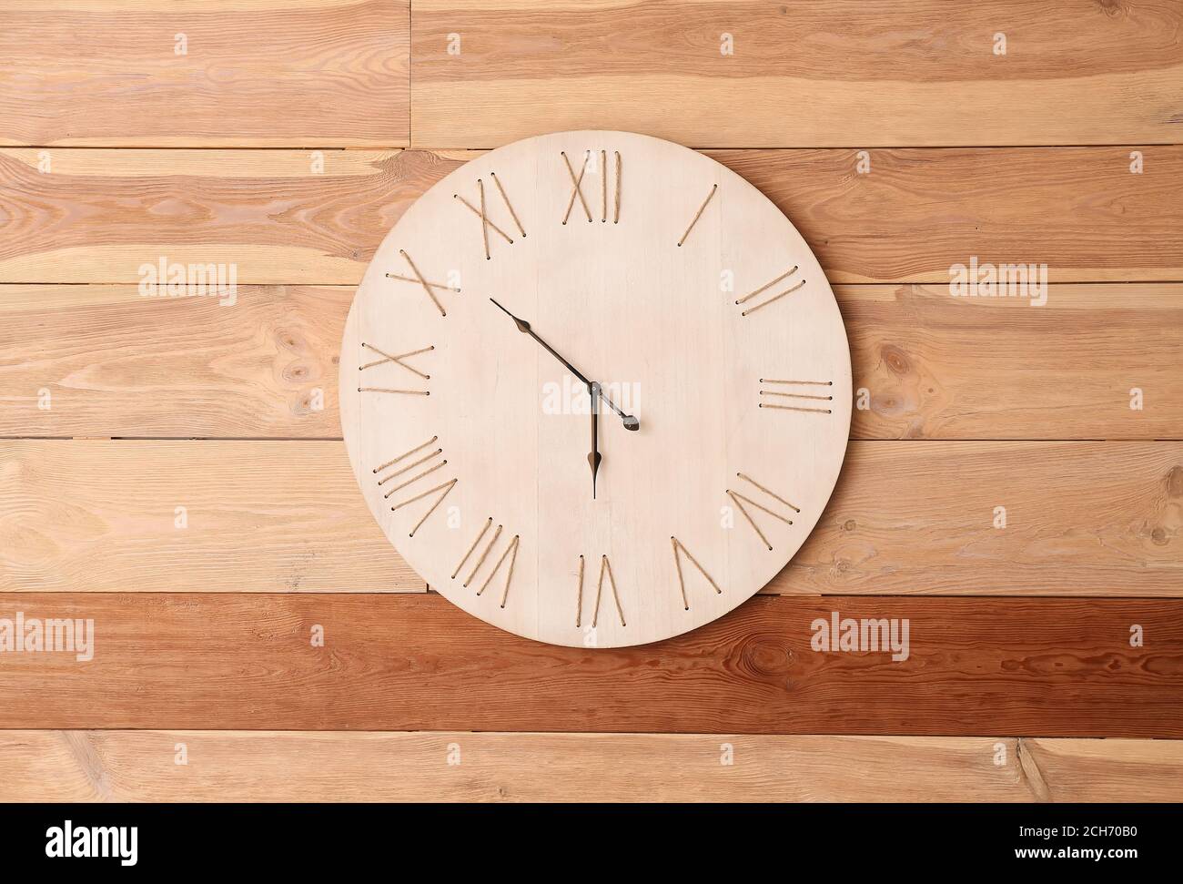 Modern clock hanging on wall Stock Photo Alamy