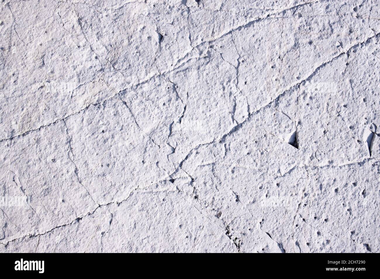 Light gray unique natural stone surface rock with interesting textured. Stock Photo