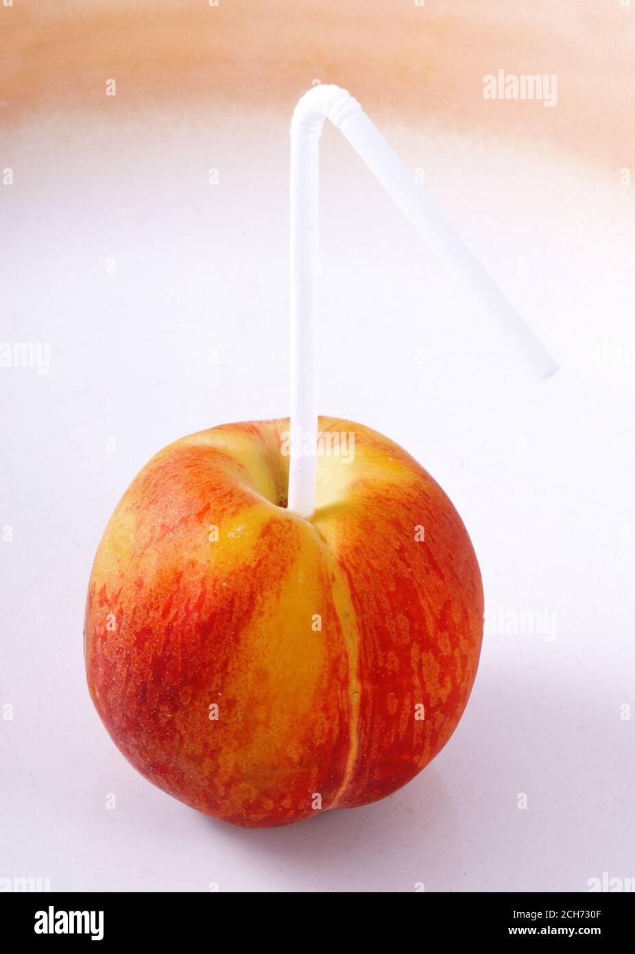 Peach with a straw. Peach Juice . Creative Stock Photo Alamy