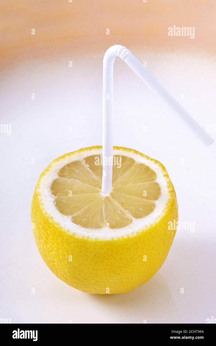 Lemon with a straw. Lemon Juice. Creative Stock Photo Alamy