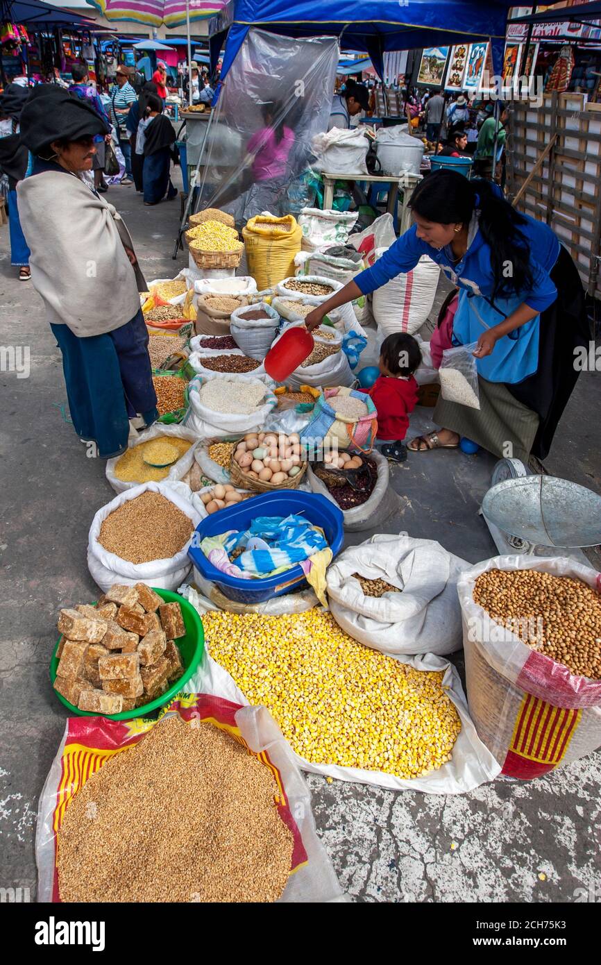 A market stall with a variety of grains and nuts for sale at the Indian market at Otavalo in Ecuador. Stock Photo