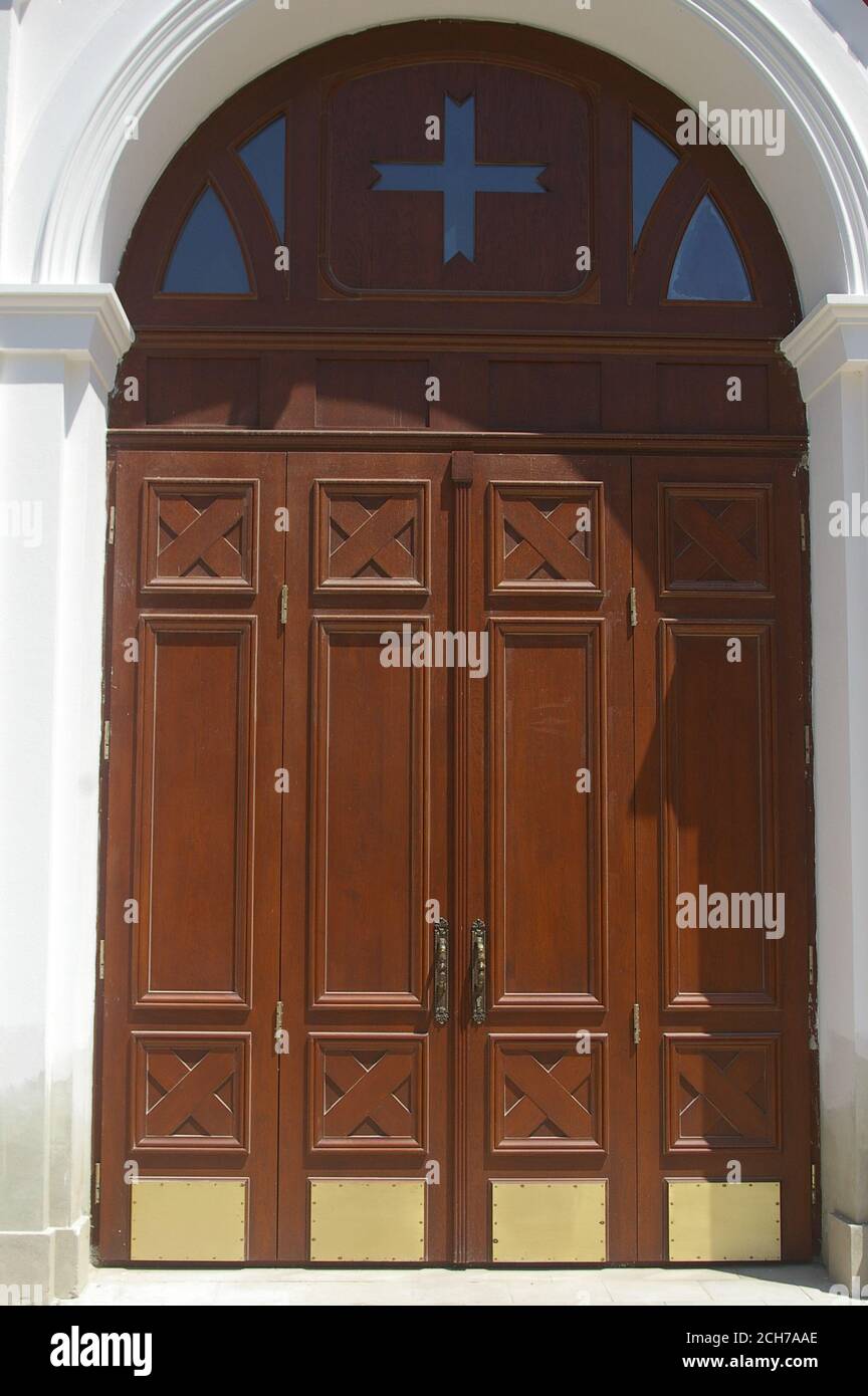 Massive wooden doors with carved cross Stock Photo Alamy