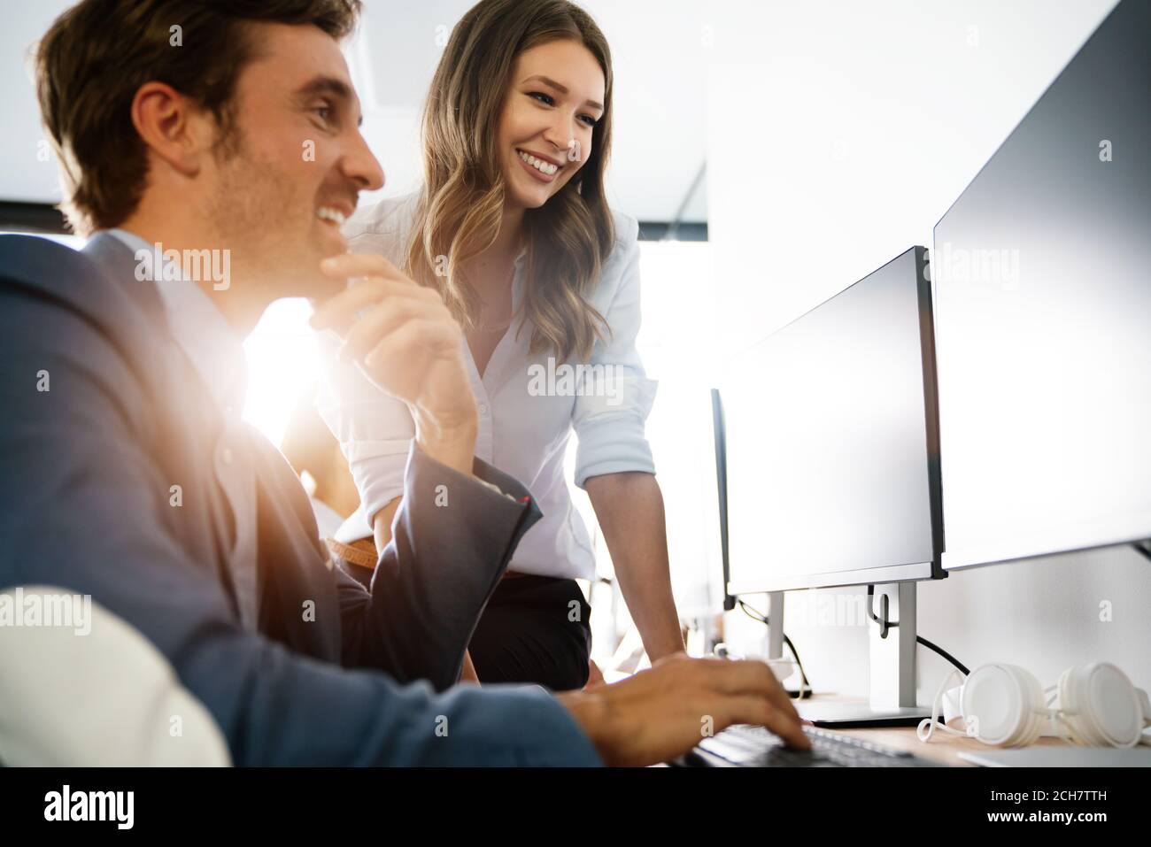 Programmers cooperating brainstorming at information technology company ...