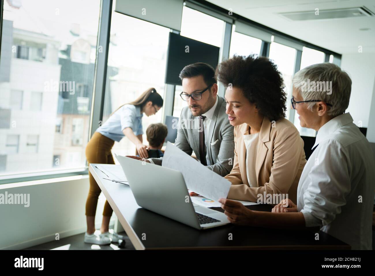 Portrait of successful business team working in office Stock Photo - Alamy