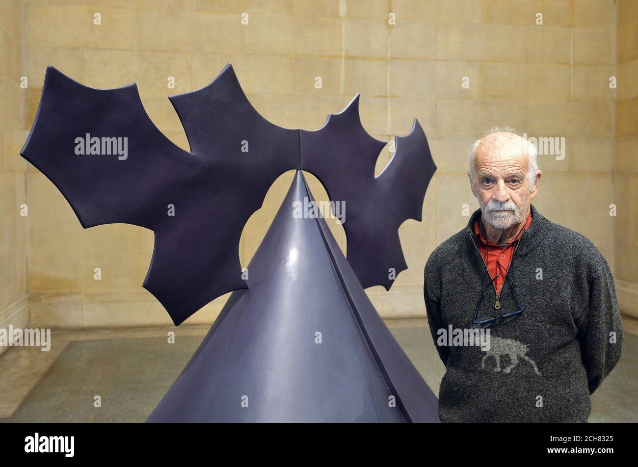 Phillip King stands inside his sculpture 'Genghis Khan', 1963, as an