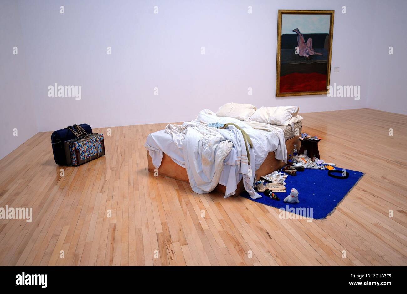Tracey Emin's 'My Bed' installation as it returns to Tate Britain for the first time in 15 years in front of Francis Bacon's 'Reclining Woman' 1961. Stock Photo