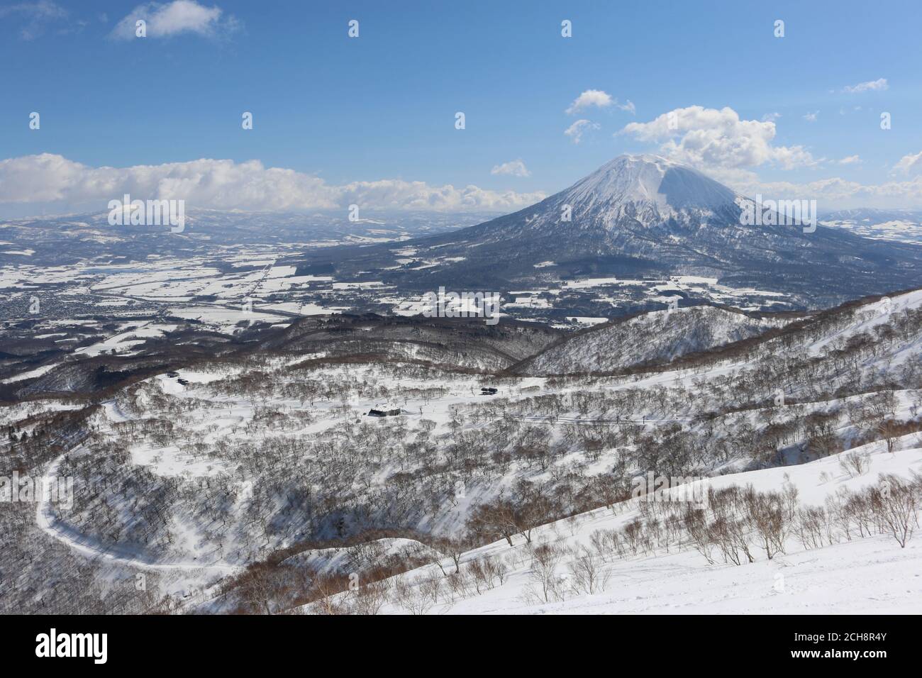 View of Niseko area ski resort and Mount Yotei volcano, Hokkaido, Japan Stock Photo