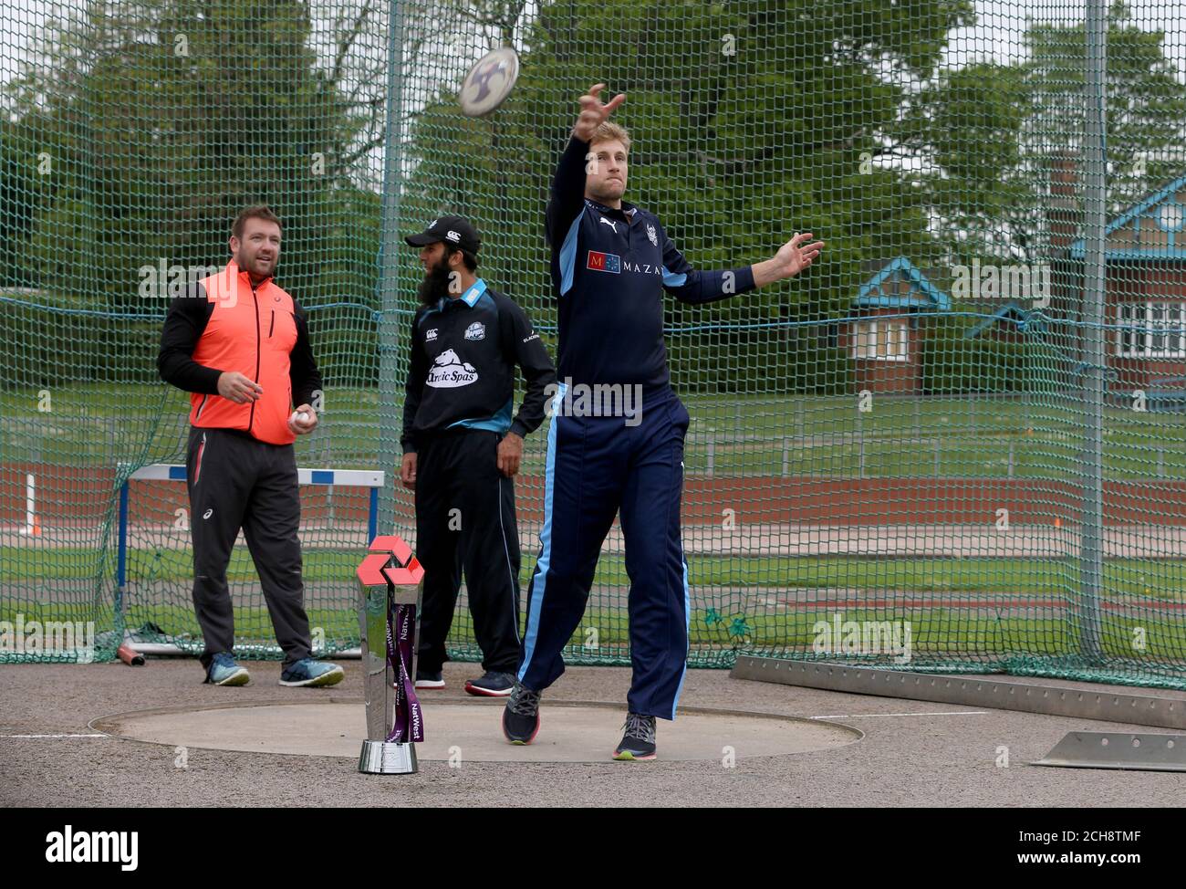 Joe Root (right) throws a discus while being watched by Dan Greaves (left) and Moeen Ali during the T20 Blast Launch at Loughborough University, Louoghborough. PRESS ASSOCIATION Photo. Picture date: Friday May 13, 2016. See PA story CRICKET T20. Photo credit should read: Simon Cooper/PA Wire. RESTRICTIONS: Editorial use only. No commercial use without prior written consent of the ECB. Still image use only. No moving images to emulate broadcast. No removing or obscuring of sponsor logos. Call +44 (0)1158 447447 for further information. Stock Photo