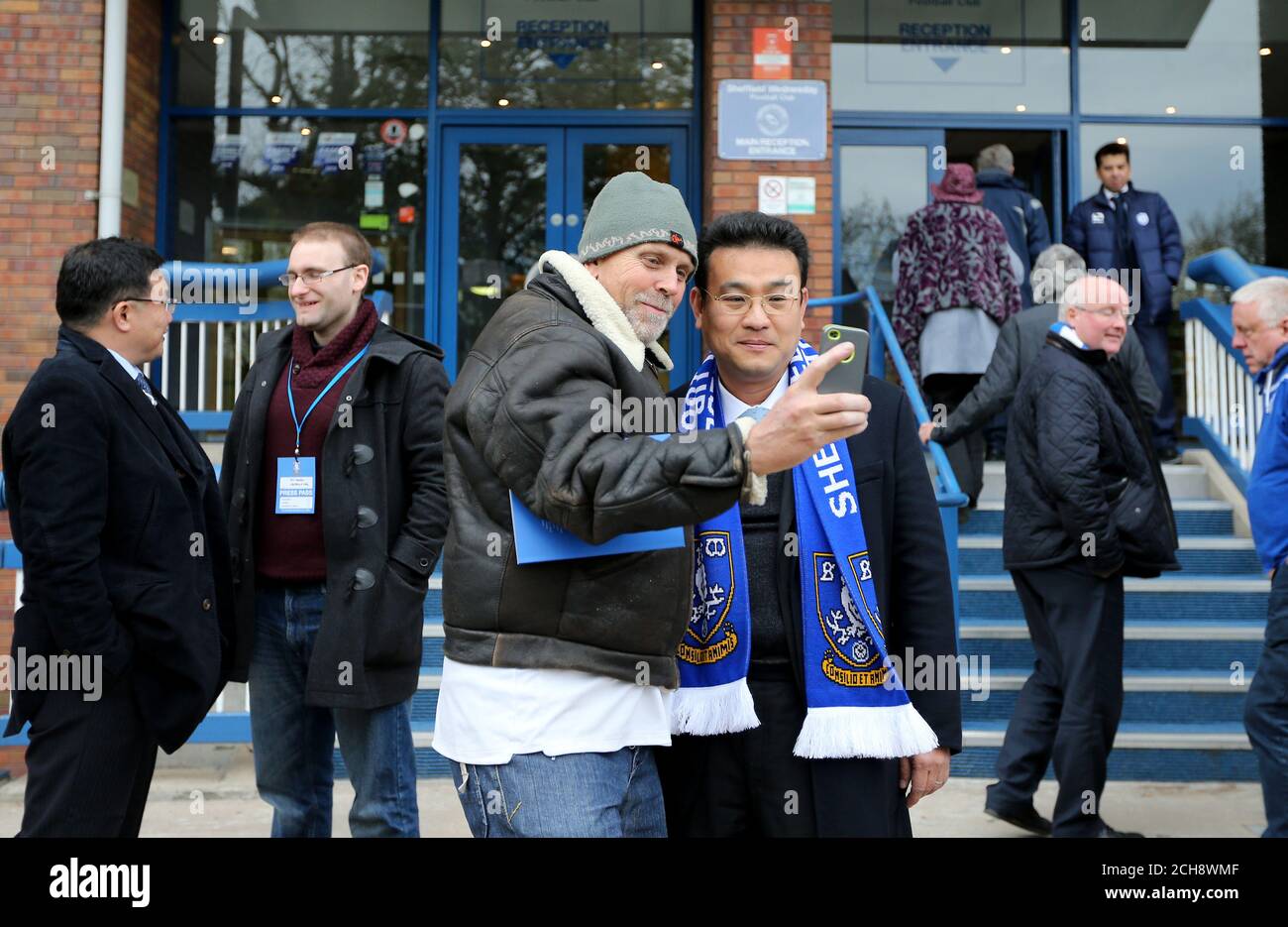 A fan poses for a picture with Sheffield Wednesday owner Dejphon Chansiri during the Sky Bet Championship playoff, Semi final, first leg match at Hillsborough, Sheffield. Stock Photo