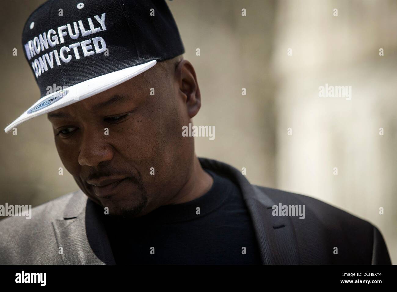 Derrick Hamilton, pauses while speaking to the press during a rally for the Wrongly Convicted at City Hall in New York April 9, 2014. Hamilton spent 20 years in prison for  murder he didn't commit and was finally released after his conviction was further investigated. REUTERS/Brendan McDermid (UNITED STATES - Tags: CRIME LAW) Stock Photo