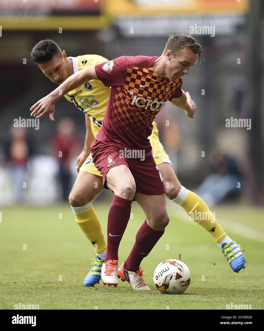 Bradford City's Tony McMahon (right) and Millwall's Joe Martin battle for the ball during the Sky Bet League One play off, first leg match at Valley Parade, Bradford. Stock Photo