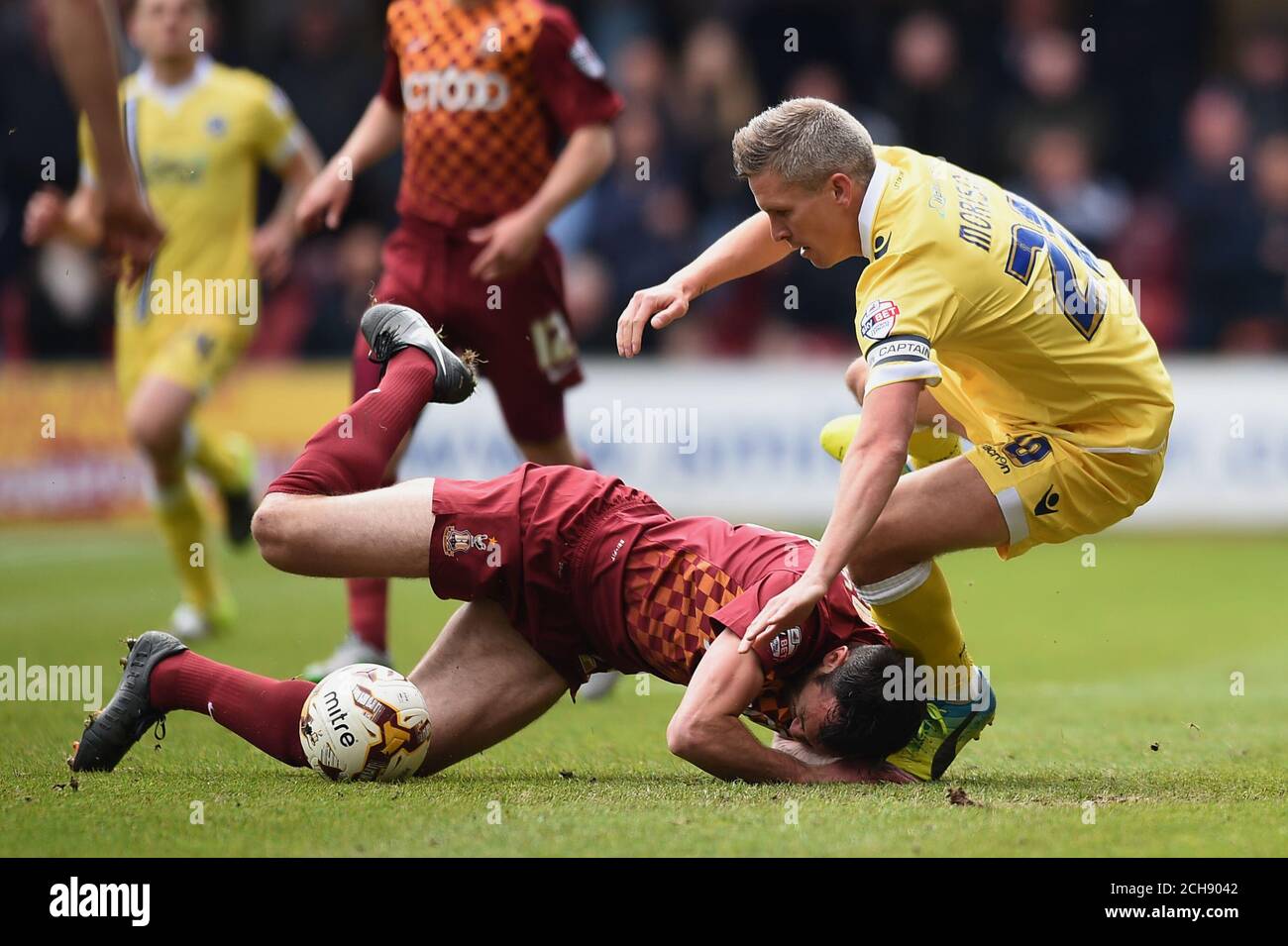 Bradford City's Rory McArdle (left) and Millwall's Steve Morison battle for the ball during the Sky Bet League One play off, first leg match at Valley Parade, Bradford. Stock Photo