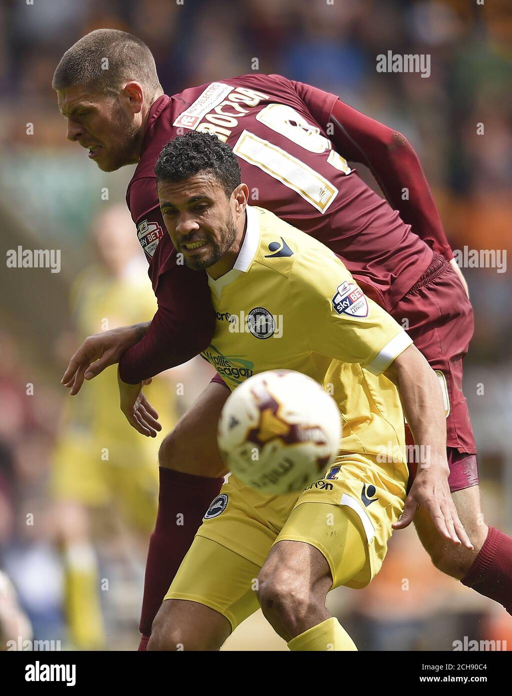 Bradford City's Jamie Proctor (left) and Milwall's Carlos Edwards battle for the ball during the Sky Bet League One play off, first leg match at Valley Parade, Bradford. Stock Photo