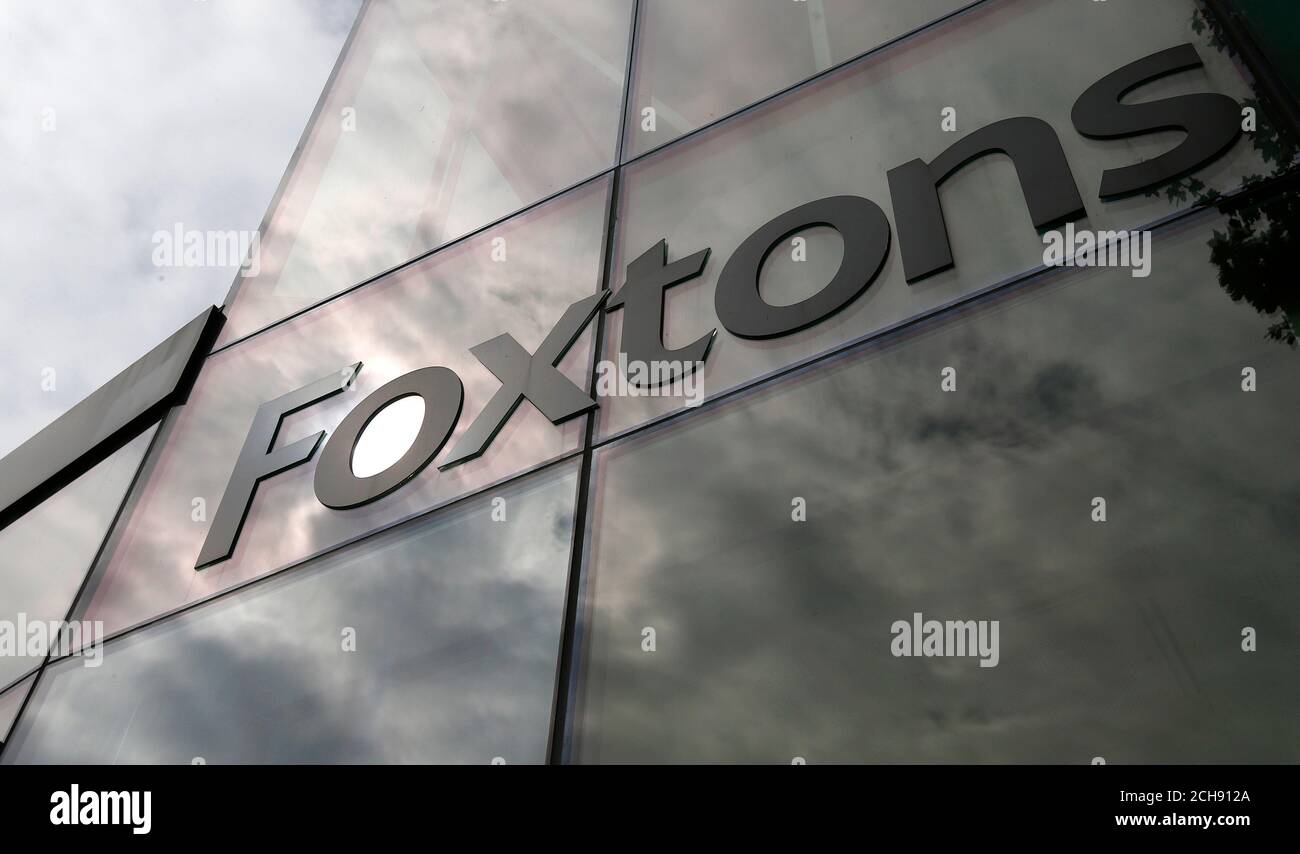 A Foxtons estate agent sign is seen on the window of a branch in north