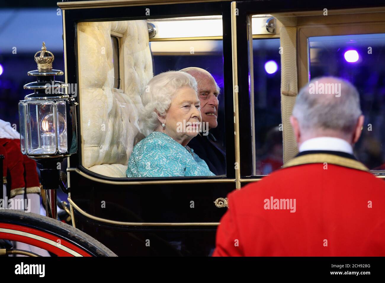 Queen Elizabeth II and the Duke of Edinburgh arrive in the Scottish State Coach during the televised celebration of the Queen's 90th birthday in the grounds of Windsor Castle in Berkshire. Stock Photo