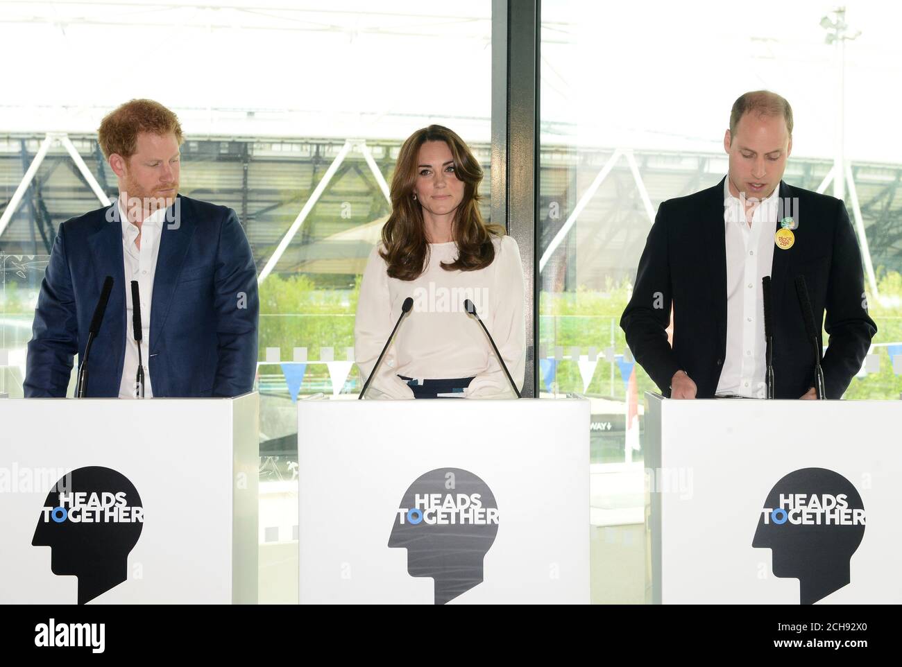 (left to right) Prince Harry, the Duchess and the Duke of Cambridge speak at the Queen Elizabeth Olympic Park in east London where they are launching Heads Together - their new campaign to end mental health stigma. Stock Photo