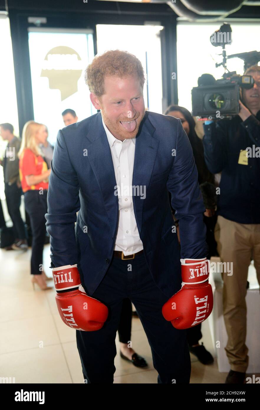 Prince Harry spars with former boxer Duke McKenzie (not pictured) at the Queen Elizabeth Olympic Park in east London, as he launches Heads Together with the Duke and Duchess of Cambridge - their new campaign to end mental health stigma. Stock Photo