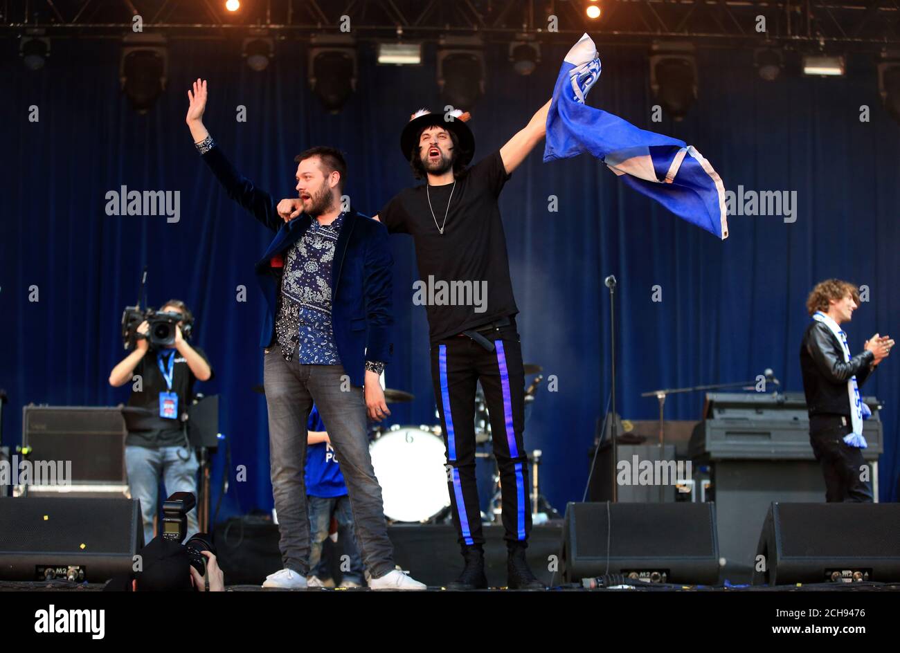 Tom Meighan (left) and Sergio Pizzorno of Kasabian perform on stage in Victoria Park after the open top bus parade through Leicester City Centre. Stock Photo