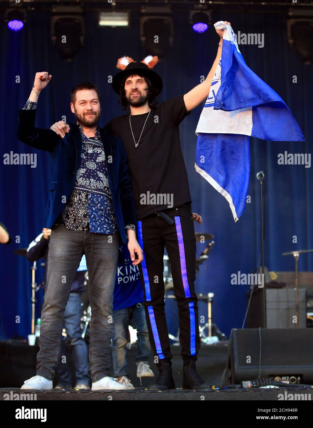 Tom Meighan (left) and Sergio Pizzorno of Kasabian on stage in Victoria Park after the open top bus parade through Leicester City Centre. Stock Photo
