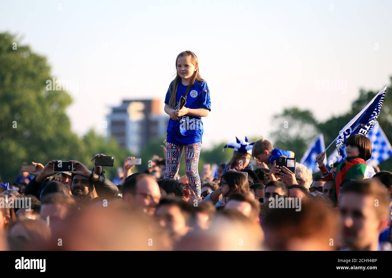 Leicester City fans celebrate in Victoria Park after the open top bus parade through Leicester City Centre. Stock Photo