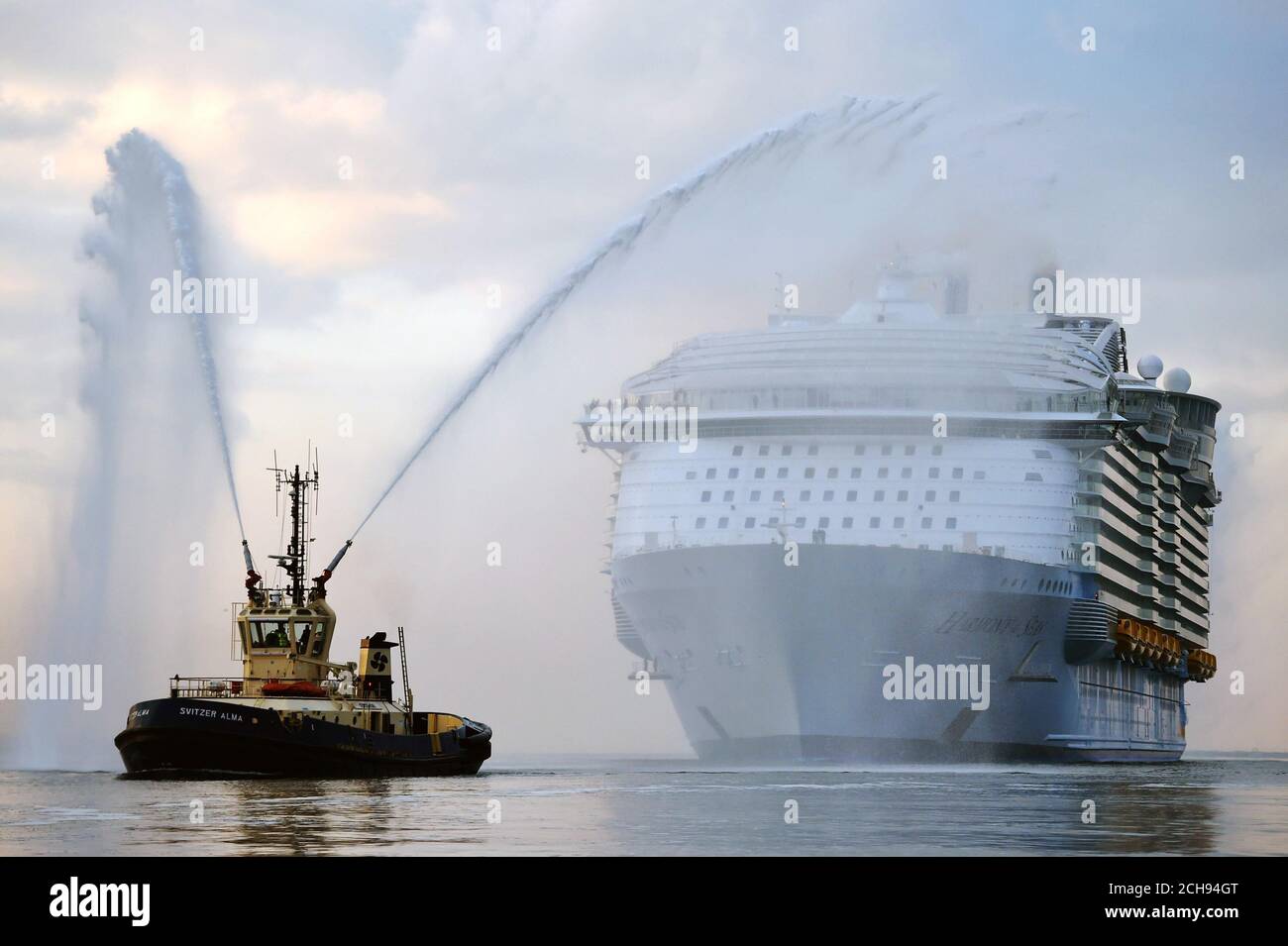 The world's largest passenger ship, MS Harmony of the Seas, owned by Royal Caribbean, makes her way up Southampton Water into Southampton ahead of her maiden cruise. Stock Photo
