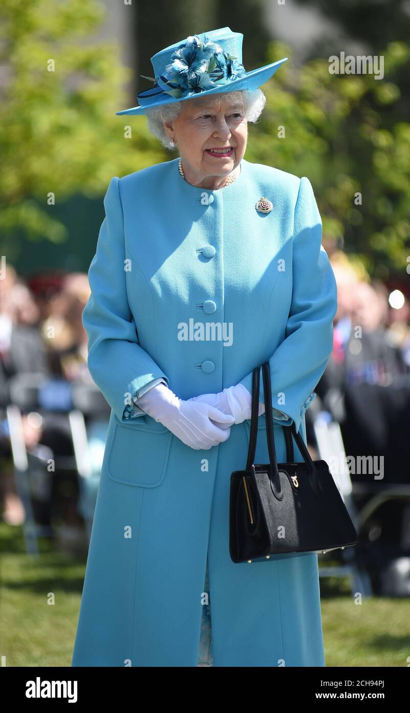 Queen Elizabeth II during a service at the National Memorial Arboretum in Alrewas, Staffordshire, in tribute to soldiers from the Duke of Lancaster's Regiment killed while serving in Afghanistan. Stock Photo