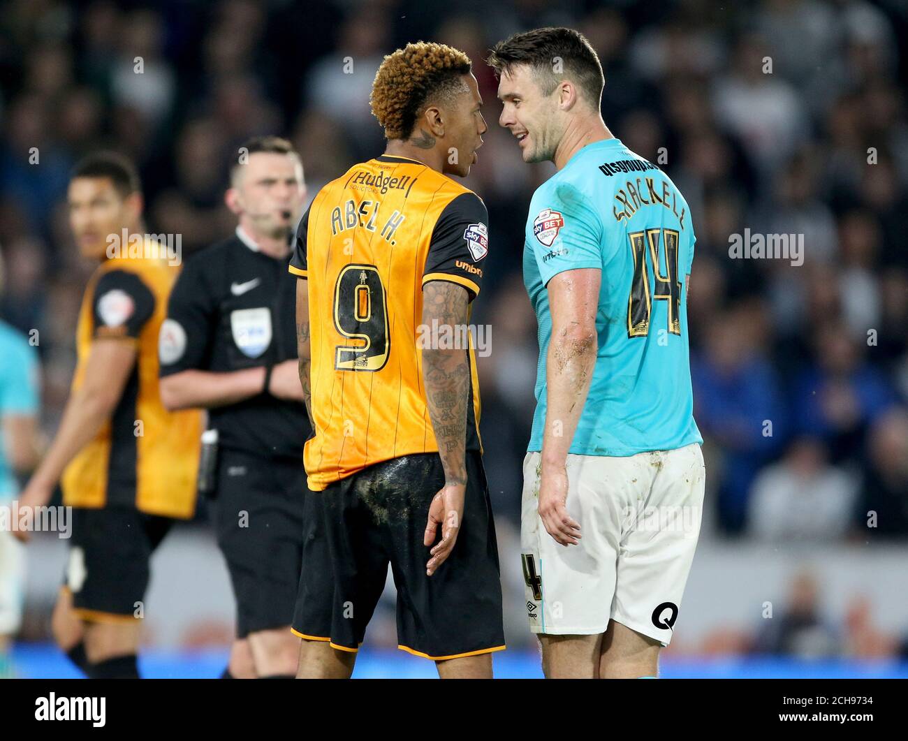 Hull City's Abel Hernandez (left) and Derby County's Jason Shackell clash during the Sky Bet Championship play off, second leg match at the KC Stadium, Hull. Stock Photo