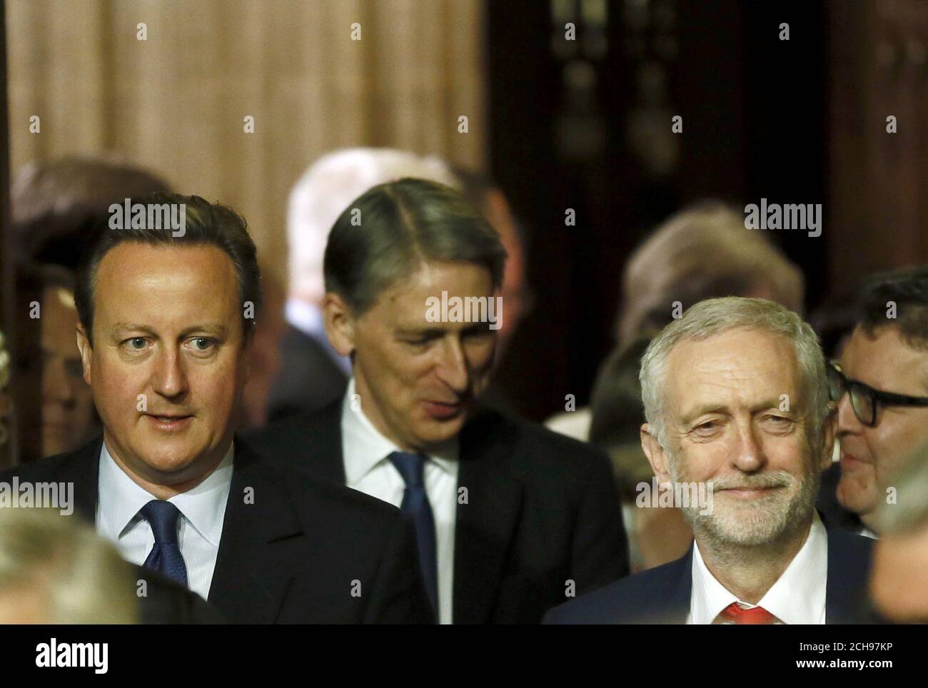 Prime Minister David Cameron (left), Foreign Secretary Philip Hammond and Labour Party leader Jeremy Corbyn (right) walk to the House of Lords for the State Opening of Parliament, at the Palace of Westminster in London. Stock Photo