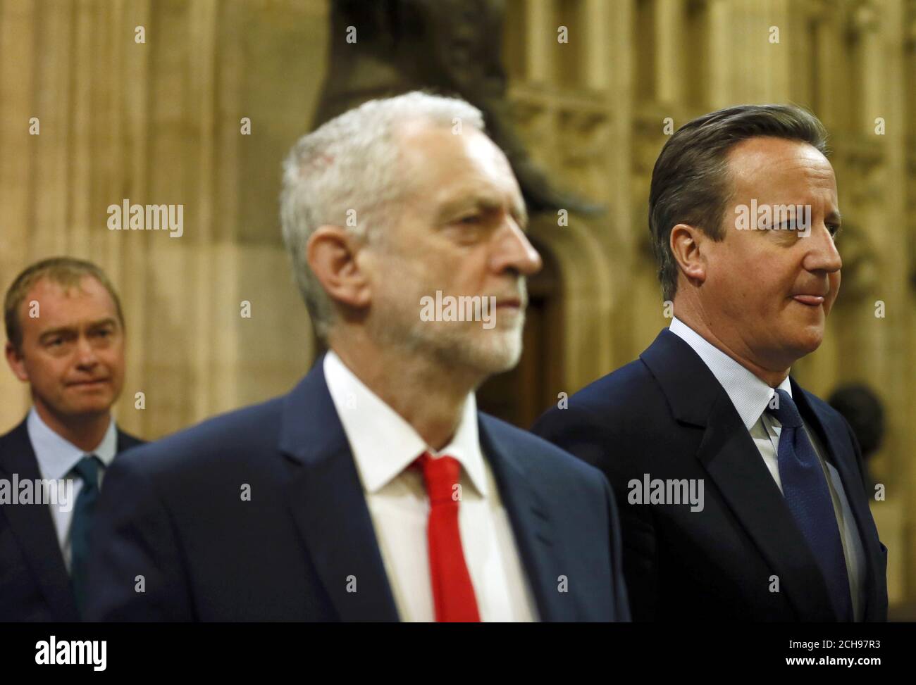 Prime Minister David Cameron (right) and Labour Party leader Jeremy Corbyn return to the House of Commons after the State Opening of Parliament, at the Palace of Westminster in London. Stock Photo
