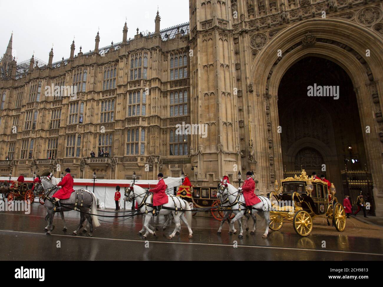Queen Elizabeth II and the Duke of Edinburgh leave the Houses of Parliament in the Diamond Jubilee state coach after the State Opening of Parliament, in the House of Lords at the Palace of Westminster in London. Stock Photo