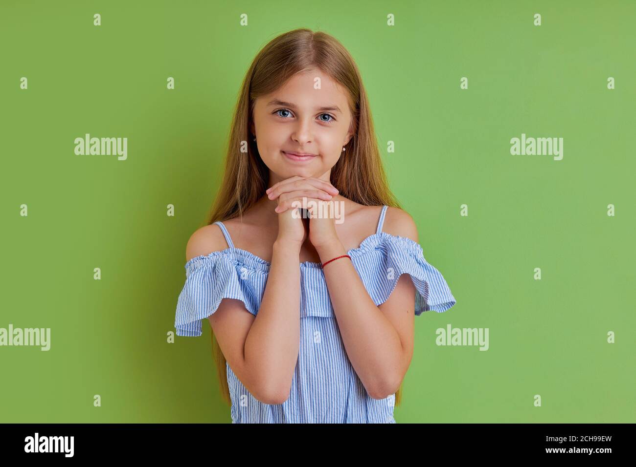 portrait of charming beautiful cute sweet lovely tender girl isolated over pink background, education holiday elementary pre teens event party celebra Stock Photo