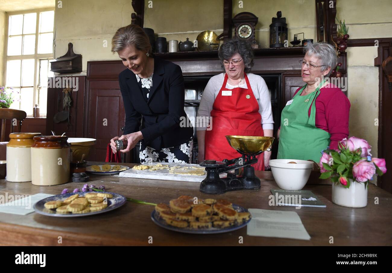 The Countess of Wessex (left) helps to make Welsh cakes in the kitchen which features in Downton Abbey, during a visit to Cogges Manor Farm in Oxfordshire, following a visit to Licensed Victuallers' School Oxford. Stock Photo