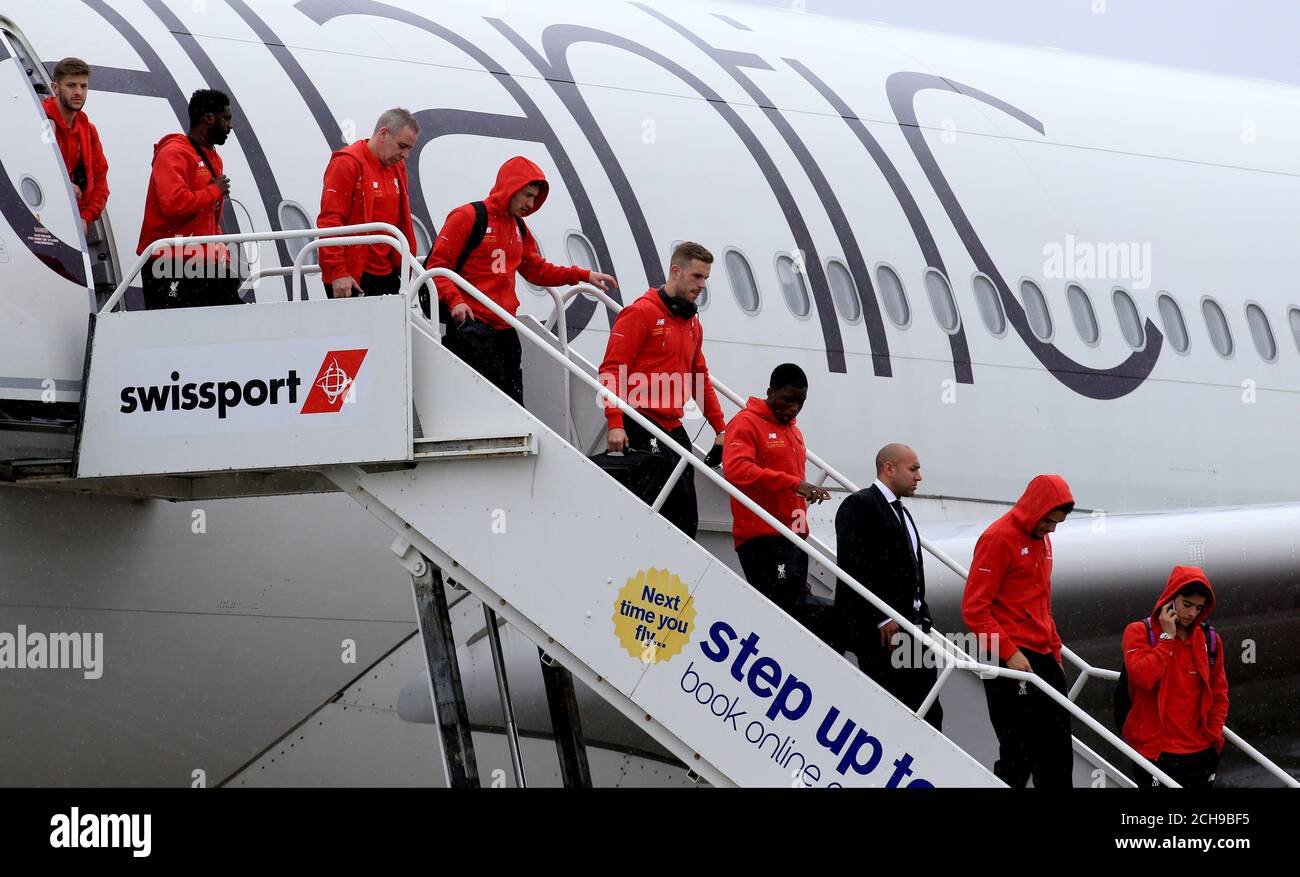 Liverpool's Jordan Henderson (centre) arrives back from the UEFA Europa League Final with his teammates, at Liverpool John Lennon Airport. Stock Photo