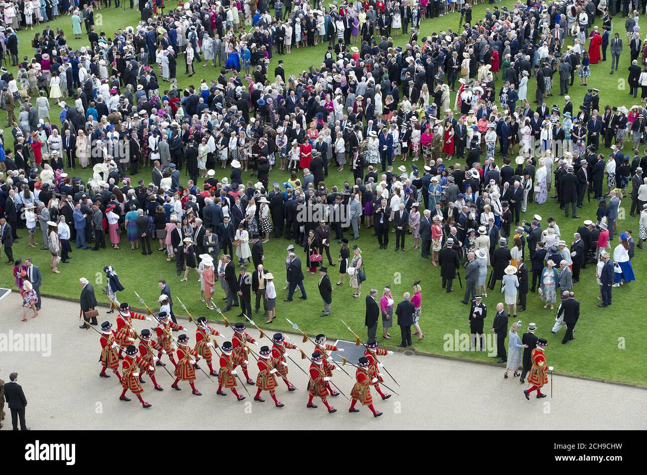 Guests attend a garden party at Buckingham Palace in London. Stock Photo