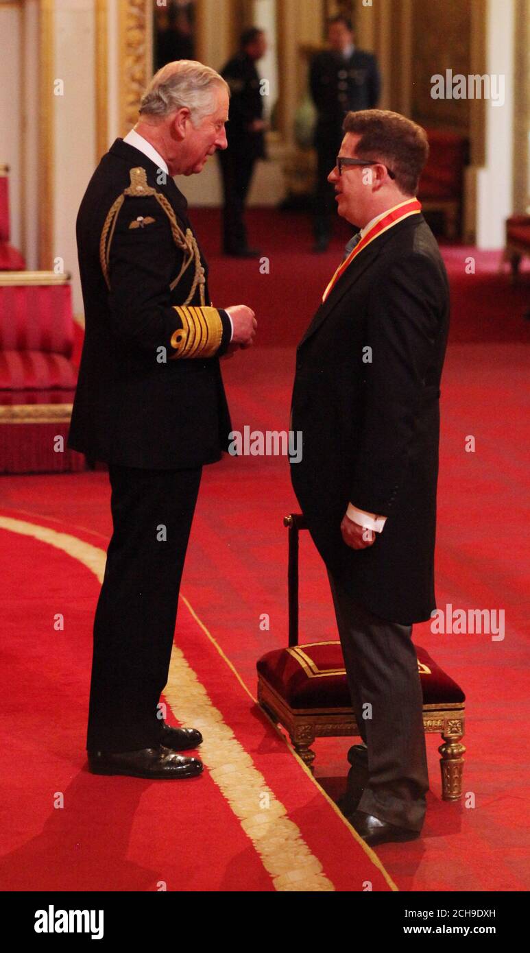 Sir Matthew Bourne from London is made a Knight Bachelor of the British Empire by the Prince of Wales at an investiture ceremony at Buckingham Palace, London. Stock Photo