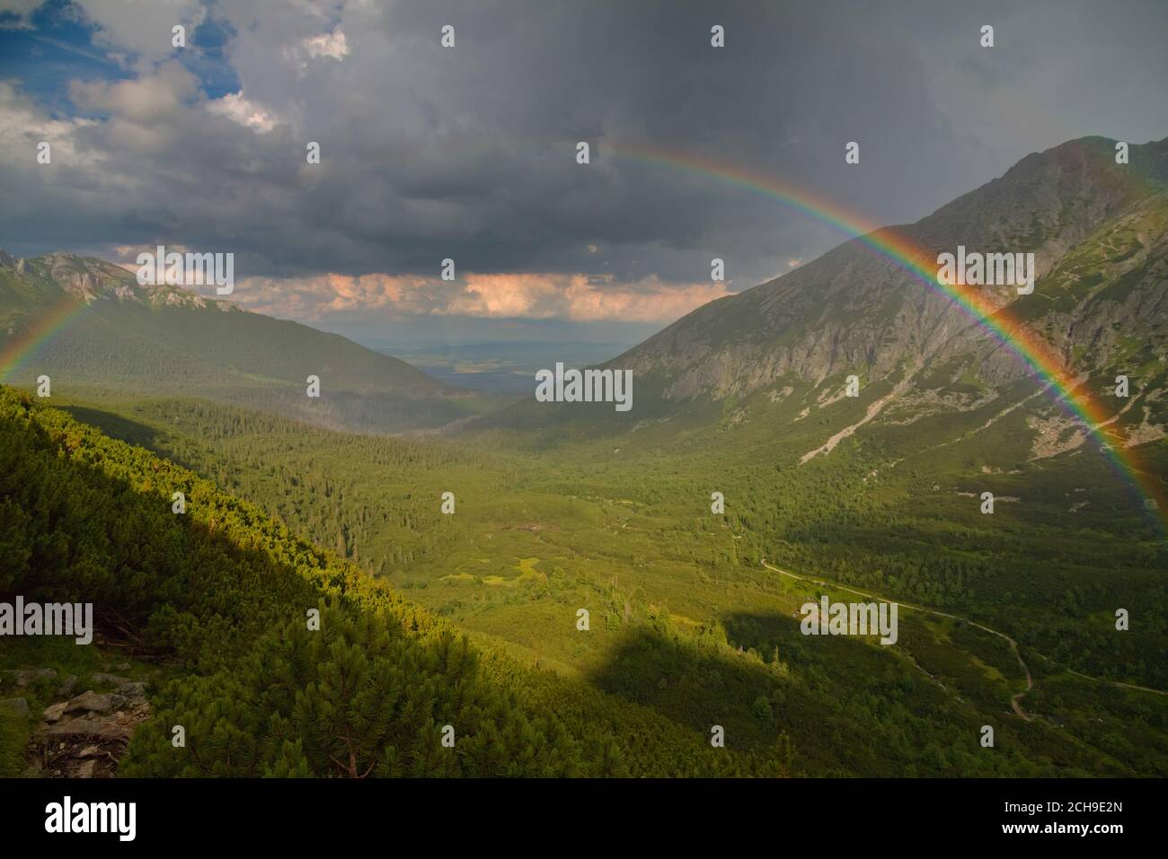 Rainbow across a valley in Tatra Moutains Stock Photo