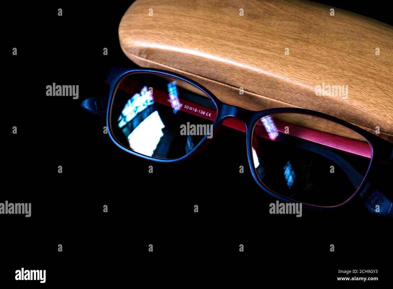 specs and specs box black background blurred shallow depth of field Stock Photo