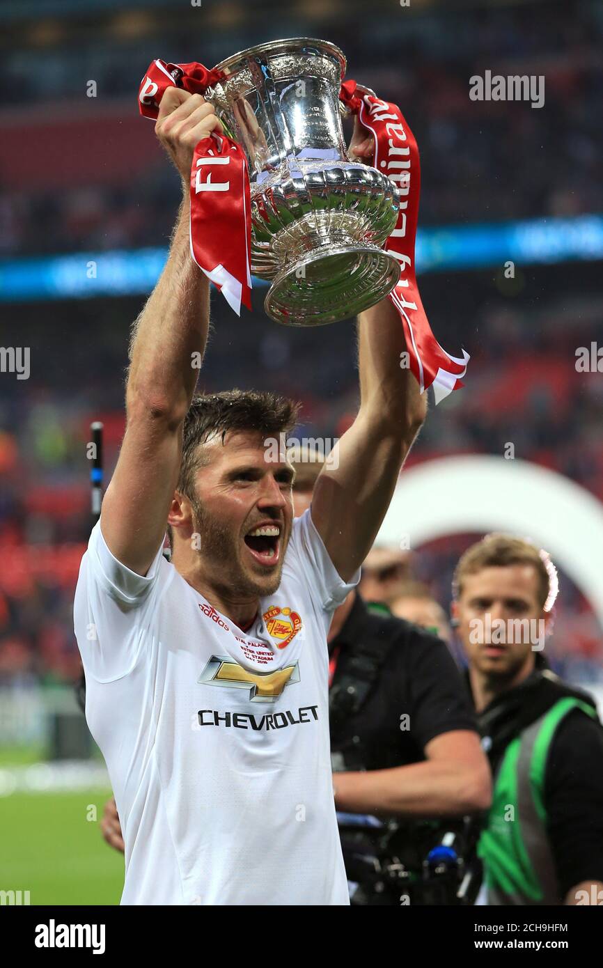 Manchester United's Michael Carrick with the FA Cup Trophy after the  Emirates FA Cup Final at Wembley Stadium. PRESS ASSOCIATION Photo. Picture  date: Saturday May 21, 2016. See PA story SOCCER Final.