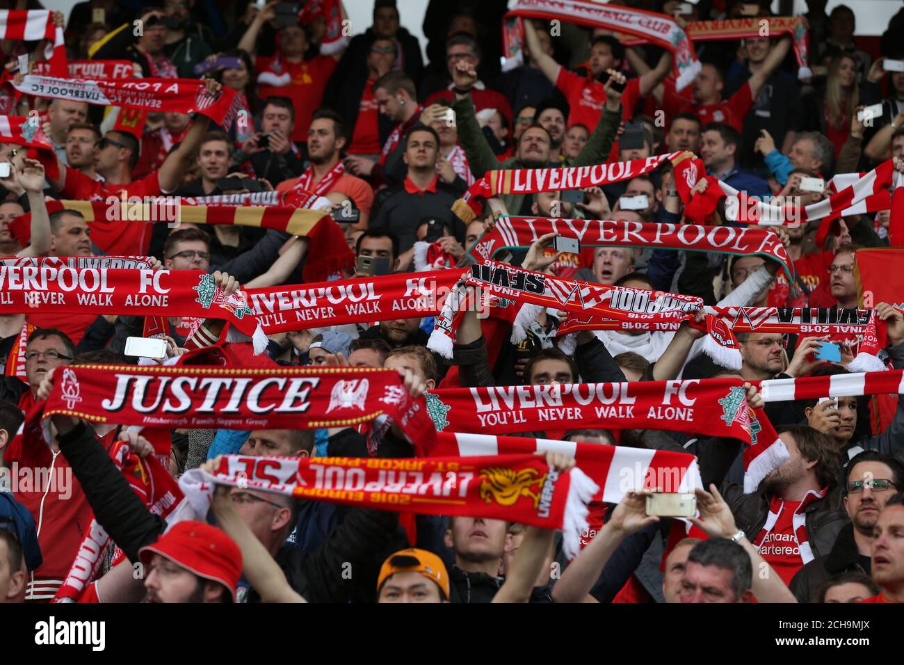 Liverpool fans hold up scarves during the match at St. Jakob-Park, Basel,  Switzerland Stock Photo - Alamy